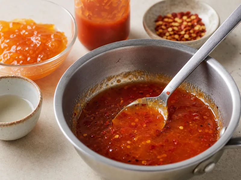 Sweet chili sauce substitutes with jam, honey, chili garlic sauce, pepper jelly, and vinegar
